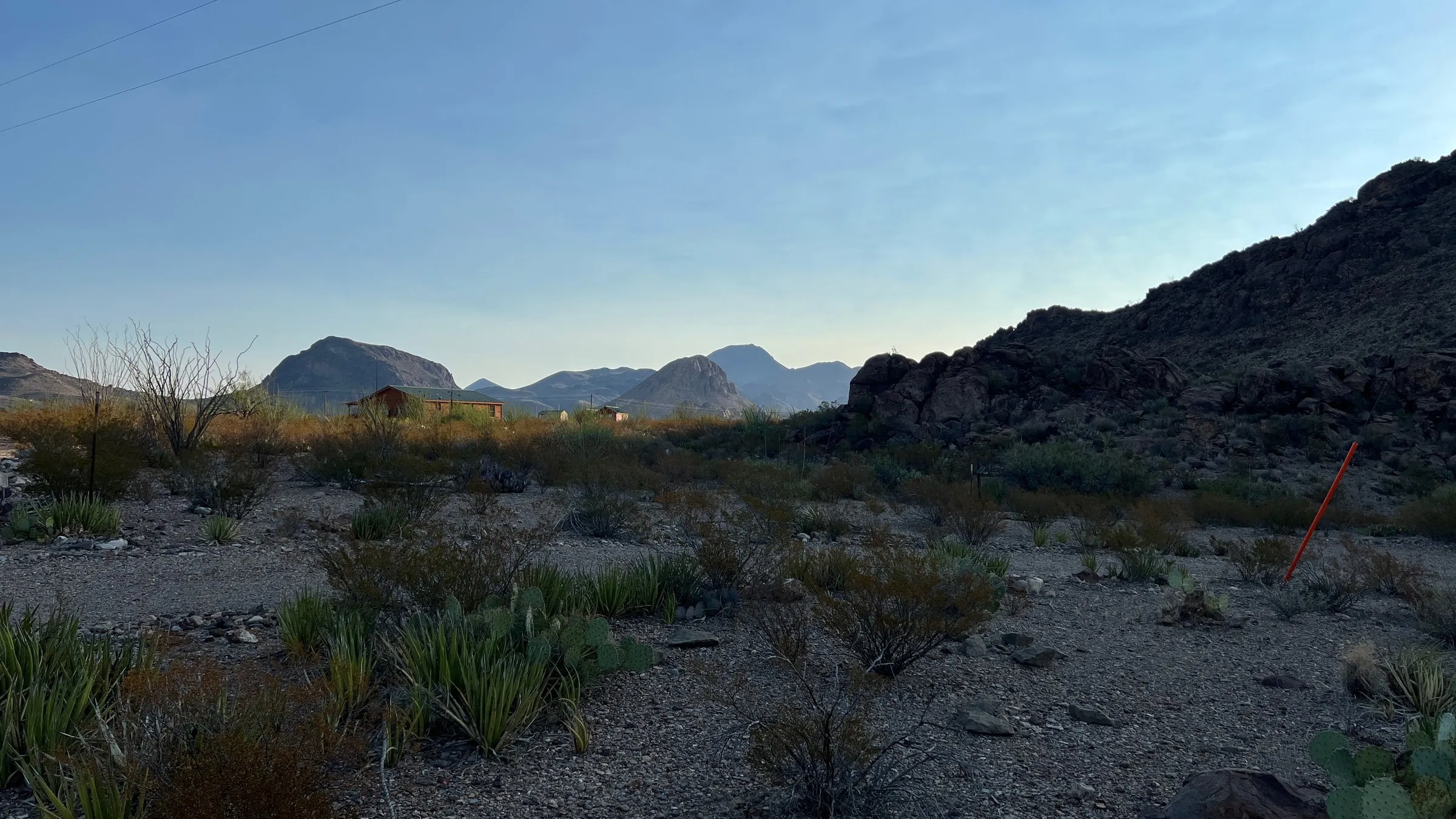 Desert scrub and mountains under a clear dusk sky in West Texas